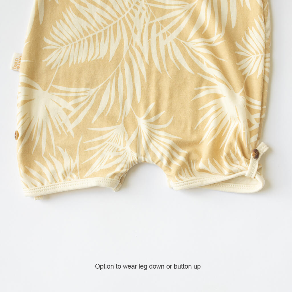 multi wearing baby playsuit yellow palm tree